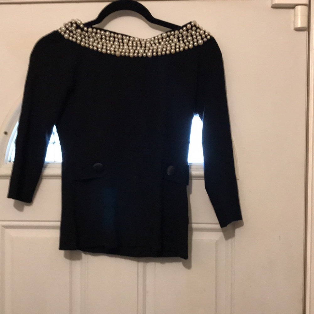 Caprice white pearls all around neck , front Botton design black top cashmere.